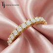 Fish tail setting full eternity diamond wedding band in 18kt yellow gold with round brilliant lab-grown diamonds.