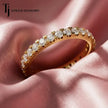 Full eternity diamond wedding band featuring a fish tail setting in 18kt yellow gold with round brilliant lab-grown diamonds.