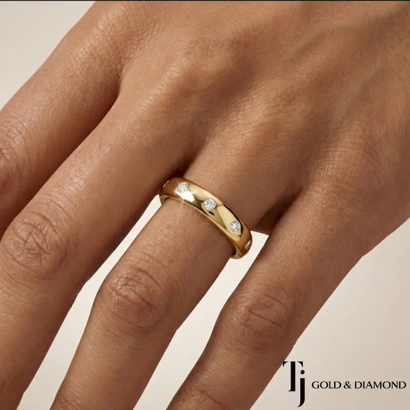 Flush setting full eternity diamond wedding band in 18kt yellow gold worn on hand with round brilliant lab-grown diamonds.