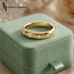 Flush Half Eternity diamond wedding band displayed on ring box, 18kt yellow gold with round brilliant diamonds set flush into the band