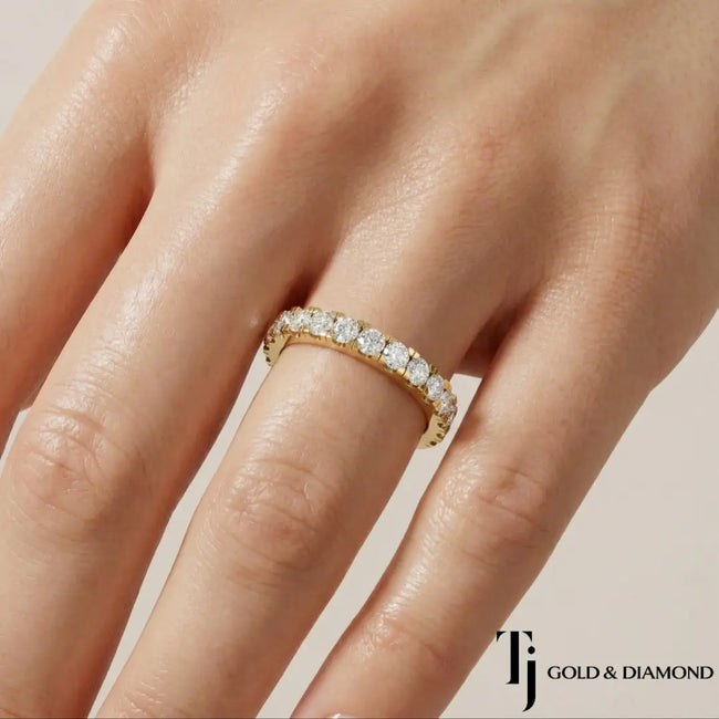 French Pavé Half Eternity diamond wedding band worn on hand, 18kt yellow gold with round brilliant lab-grown diamonds