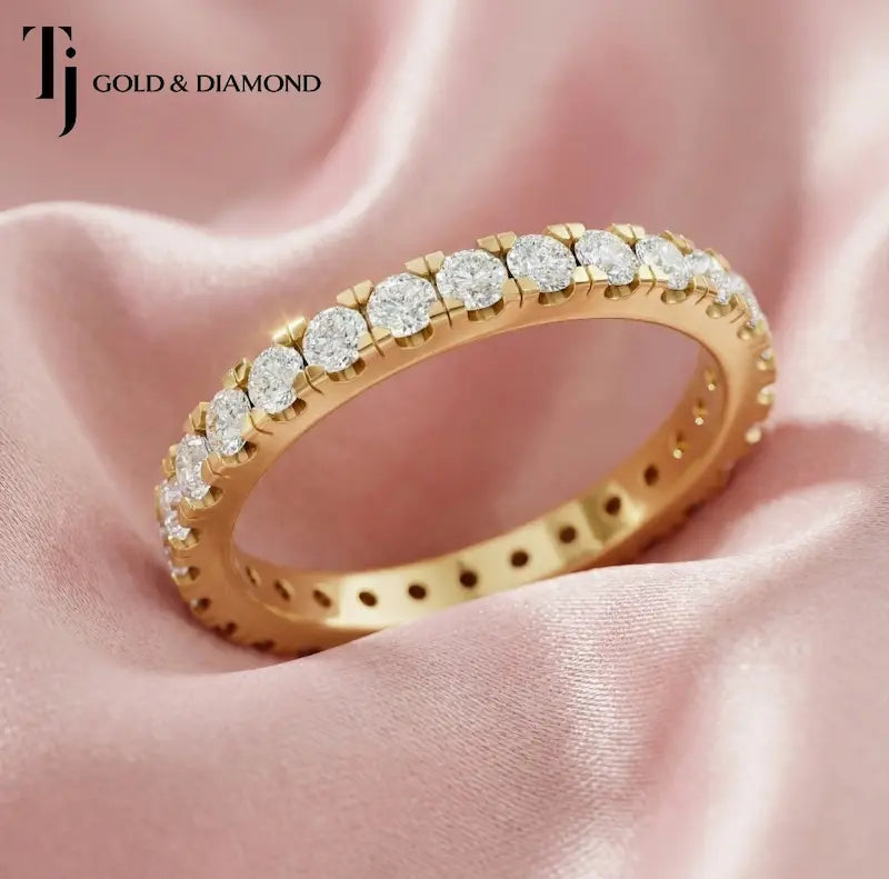 Luxury French pavé setting full eternity diamond wedding band crafted in 18kt yellow gold with round brilliant lab-grown diamonds.