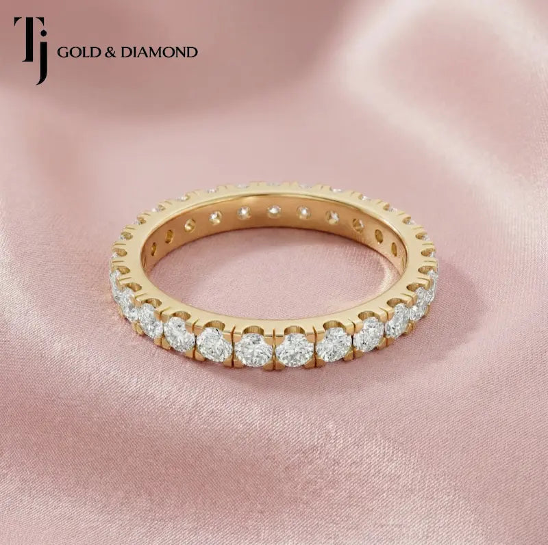 Full eternity diamond wedding band featuring a French pavé setting in 18kt yellow gold with round brilliant lab-grown diamonds.