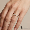 French pavé setting full eternity diamond wedding band in 18kt yellow gold worn on hand with round brilliant lab-grown diamonds.