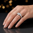 Heart cut three-stone lab-grown diamond engagement ring in 18kt white gold with diamond shoulders worn on hand