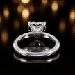 Back view of 4-claw heart cut engagement ring with hidden halo in 18kt white gold