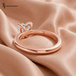 Back view of a 1.5 carat heart cut lab-grown diamond solitaire engagement ring in 18kt rose gold with a 4-claw setting