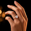 1.5 carat heart cut diamond solitaire engagement ring in an 18kt rose gold 4 claw setting worn on a hand, by TJ Diamond