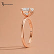 Side profile view of a 1.5 carat heart cut lab-grown diamond solitaire engagement ring in 18kt rose gold