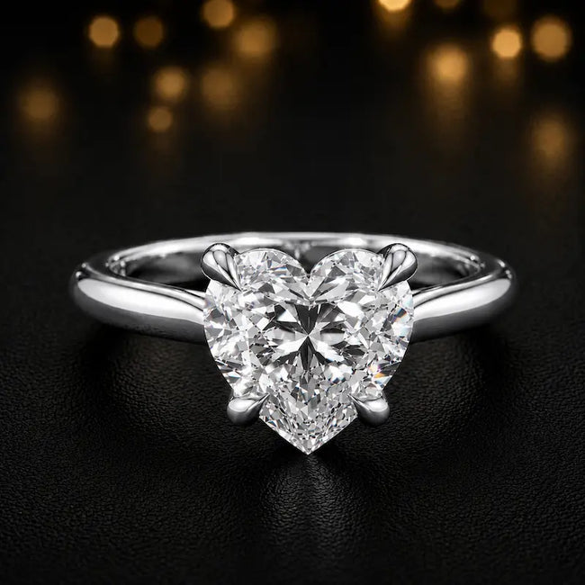 360-degree rotating view of a 1.5 carat heart cut diamond solitaire engagement ring in an 18kt rose gold 4 claw setting by TJ Diamond