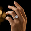 1.5 carat heart cut diamond solitaire engagement ring in an 18kt white gold 4 claw setting worn on a hand, by TJ Diamond