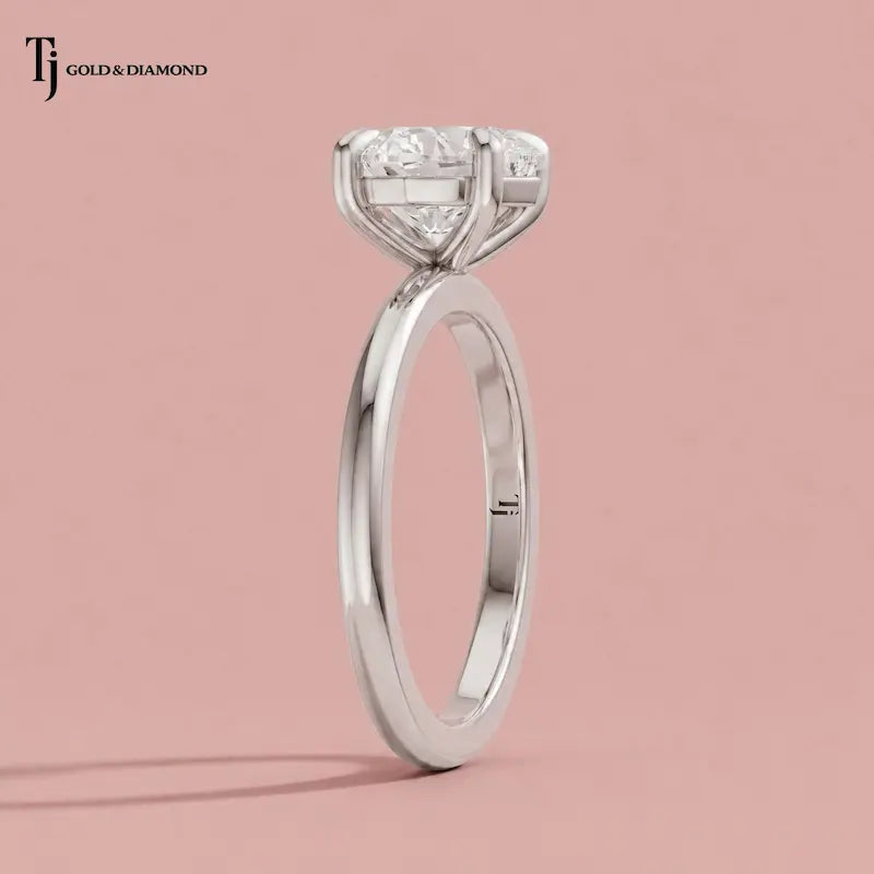 Side profile view of a 1.5 carat heart cut lab-grown diamond solitaire engagement ring in 18kt white gold