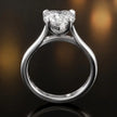 Front-on view of a 1.5 carat heart cut diamond solitaire engagement ring showing the full 18kt white gold band and 4 claw cathedral setting by TJ Diamond