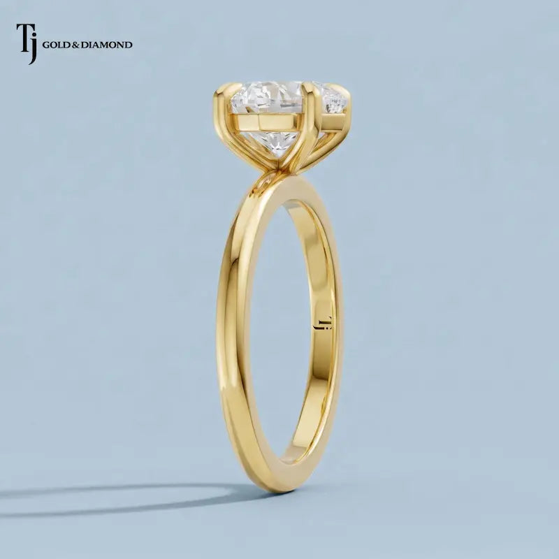 Side profile view of a 1.5 carat heart cut lab-grown diamond solitaire engagement ring in 18kt yellow gold