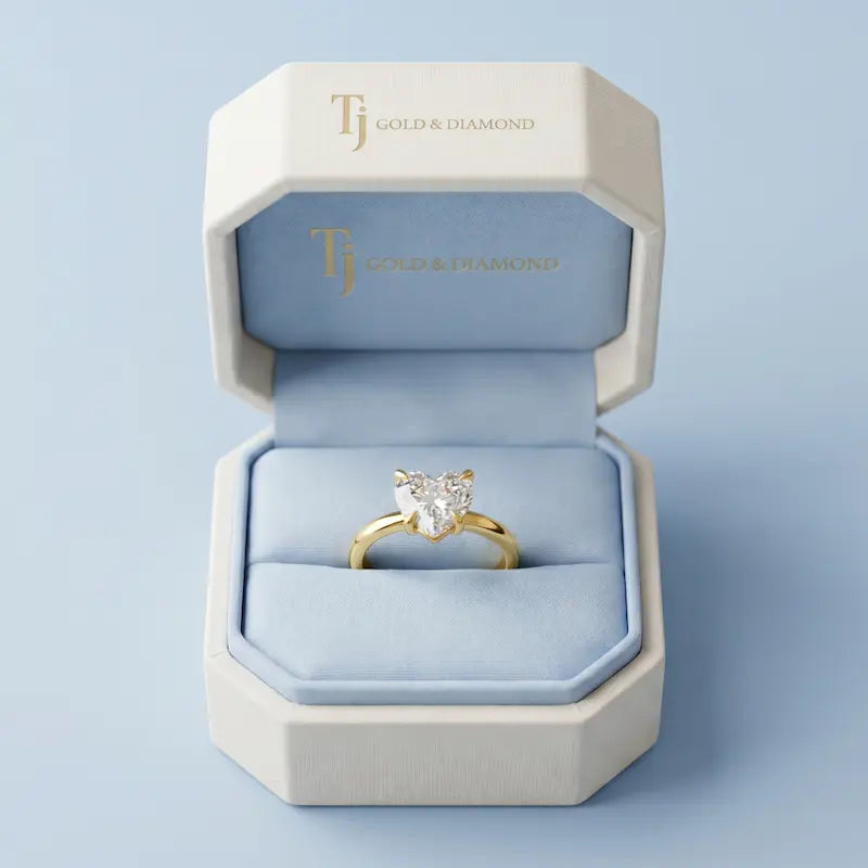 1.5 carat heart cut lab-grown diamond solitaire engagement ring in 18kt yellow gold in a TJ Diamond box