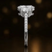 Side profile of a marquise cut three-stone lab-grown diamond engagement ring in 18kt white gold showing the diamond band