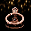 Back view of 4-claw marquise cut engagement ring with hidden halo in 18kt rose gold