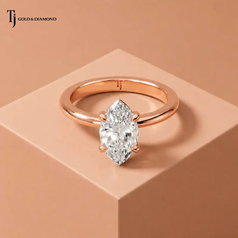 Front view of a 1.5 carat marquise cut lab-grown diamond solitaire engagement ring in 18kt rose gold with a 4-claw setting