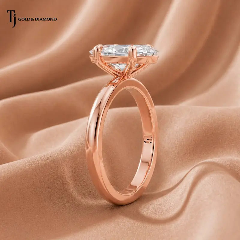 Side profile view of a 1.5 carat marquise cut lab-grown diamond solitaire engagement ring in 18kt rose gold