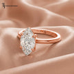 Side view of a 1.5 carat marquise cut lab-grown diamond solitaire engagement ring in 18kt rose gold on satin