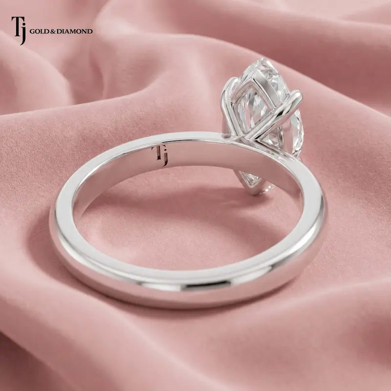 Back view of a 1.5 carat marquise cut lab-grown diamond solitaire engagement ring in 18kt white gold with a 4-claw setting