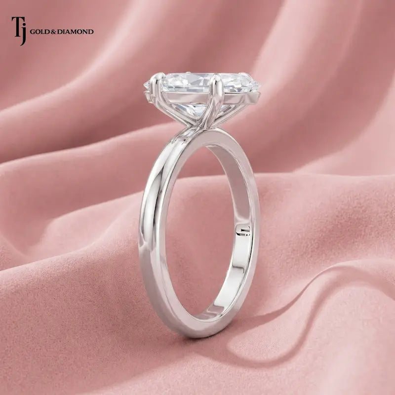 Side profile view of a 1.5 carat marquise cut lab-grown diamond solitaire engagement ring in 18kt white gold
