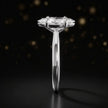 Side profile of a 1.5 carat marquise cut diamond solitaire engagement ring showing the cathedral setting and 18kt white gold band by TJ Diamond