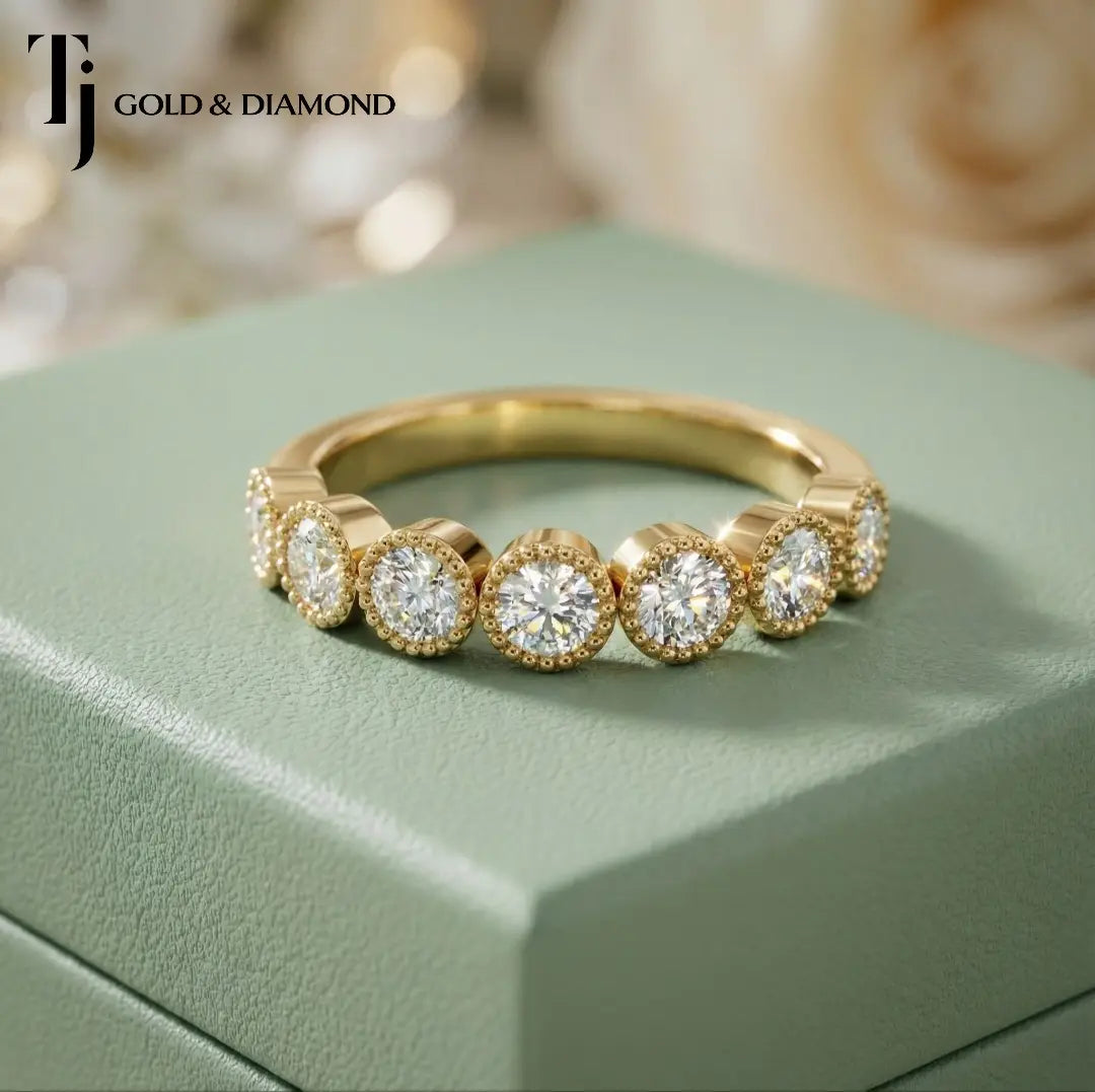 Front view of Milgrain Bezel Half Eternity diamond wedding band in 18kt yellow gold, round brilliant diamonds in individual milgrain bezels