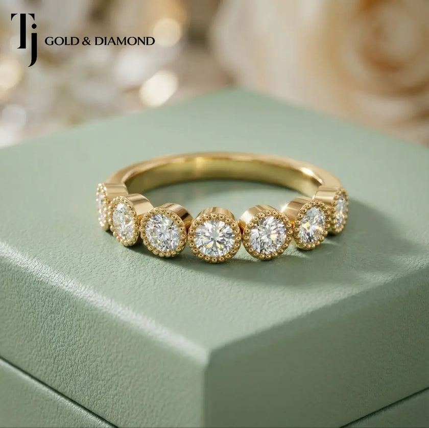 Front view of Milgrain Bezel Half Eternity diamond wedding band in 18kt yellow gold, round brilliant diamonds in individual milgrain bezels