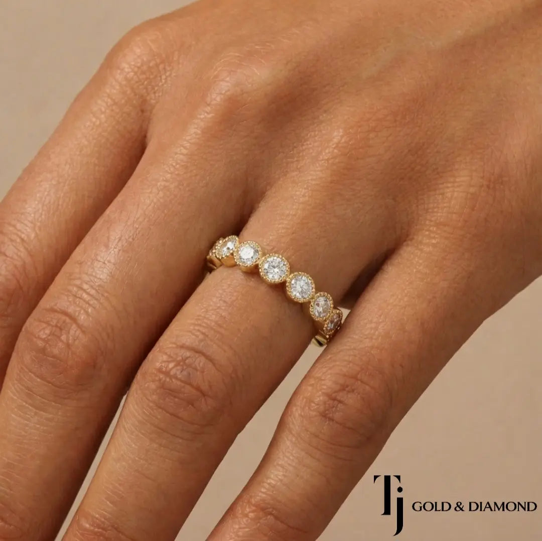 Milgrain Bezel Half Eternity diamond wedding band worn on hand, 18kt yellow gold with round brilliant lab-grown diamonds