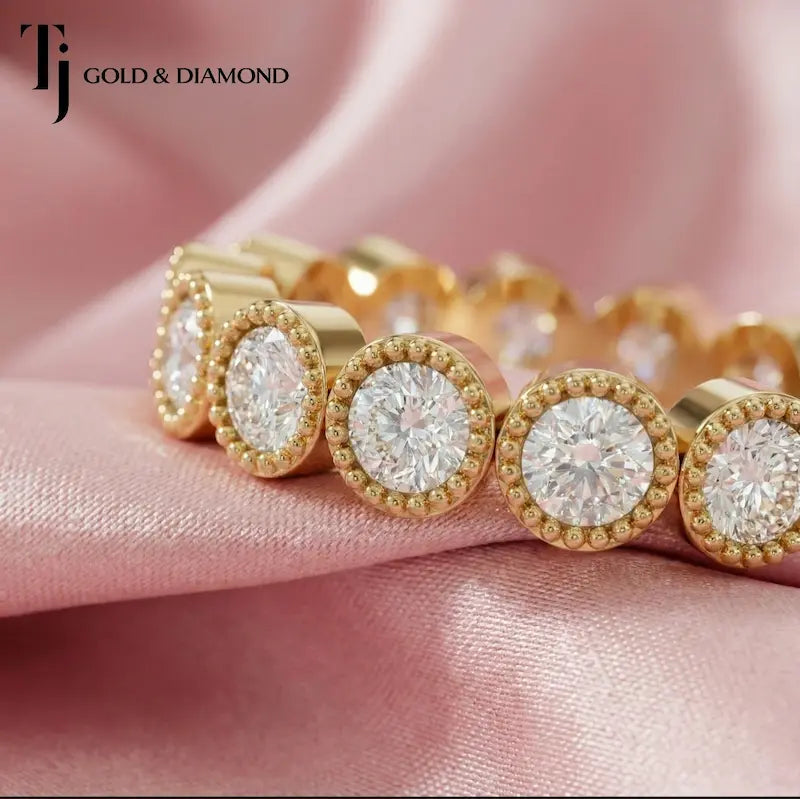 Milgrain bezel setting full eternity diamond wedding band in 18kt yellow gold with round brilliant lab-grown diamonds.