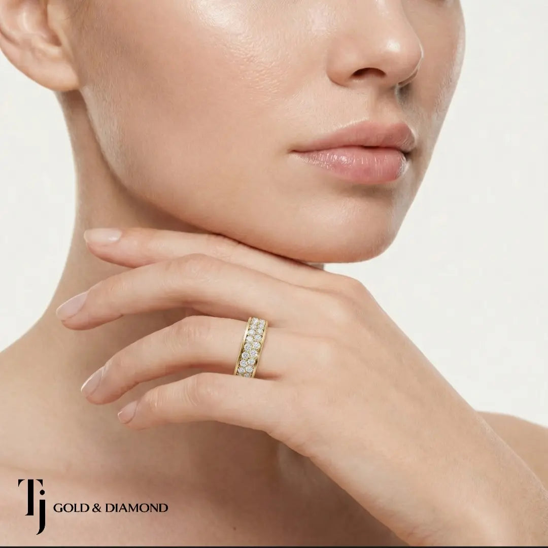 Model wearing Multi-Row Pavé Half Eternity diamond wedding band in 18kt yellow gold, close-up lifestyle shot.