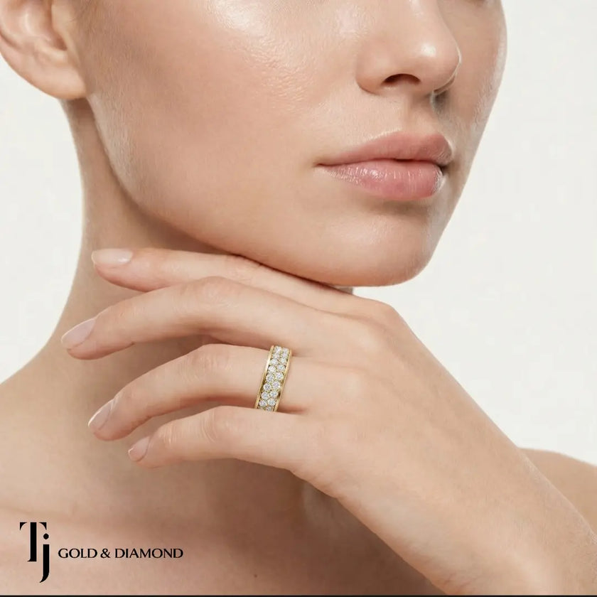 Model wearing Multi-Row Pavé Half Eternity diamond wedding band in 18kt yellow gold, close-up lifestyle shot.