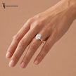 1.5 carat oval cut lab-grown diamond solitaire engagement ring in 18kt rose gold worn on hand