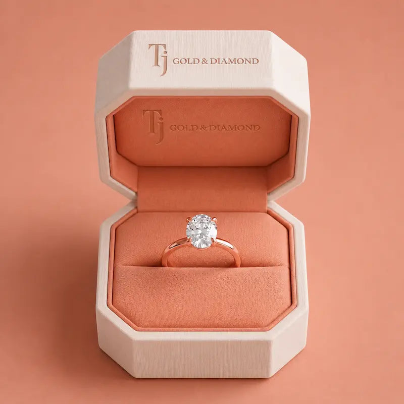 1.5 carat oval cut lab-grown diamond solitaire engagement ring in 18kt rose gold in a TJ Diamond box