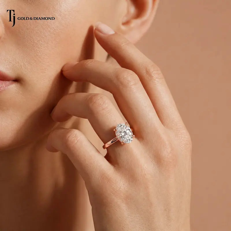 1.5 carat oval cut lab-grown diamond solitaire engagement ring in 18kt rose gold on model