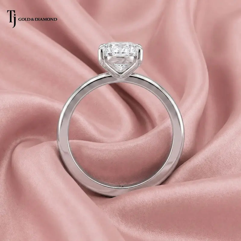 Front-on view of a 1.5 carat oval cut lab-grown diamond solitaire engagement ring in 18kt white gold with a 4-claw setting