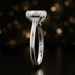 Side profile of a 1.5 carat oval cut diamond solitaire engagement ring showing the cathedral setting and 18kt white gold band by TJ Diamond