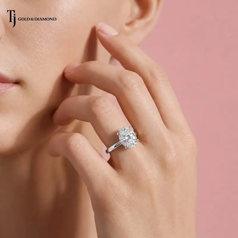 1.5 carat oval cut lab-grown diamond solitaire engagement ring in 18kt white gold on model
