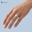 1.5 carat oval cut lab-grown diamond solitaire engagement ring in 18kt yellow gold worn on hand