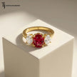 Front view of an oval cut lab-created ruby trilogy engagement ring in 18kt yellow gold with oval lab-grown diamond side stones.