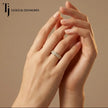Model wearing a pavé setting full eternity diamond wedding band in 18kt yellow gold with round brilliant lab-grown diamonds.