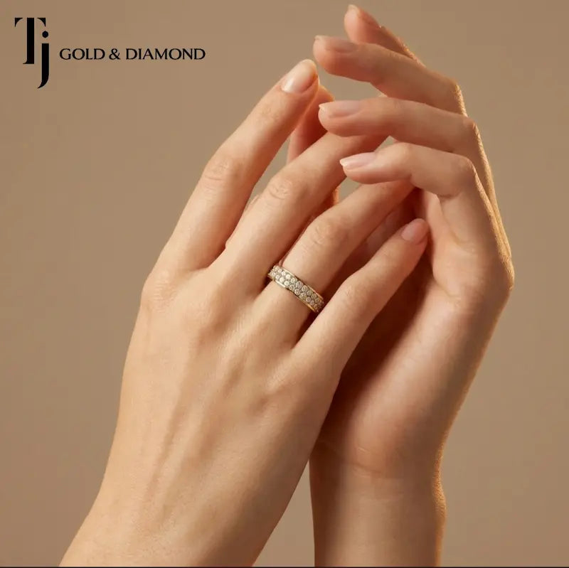 Model wearing a pavé setting full eternity diamond wedding band in 18kt yellow gold with round brilliant lab-grown diamonds.