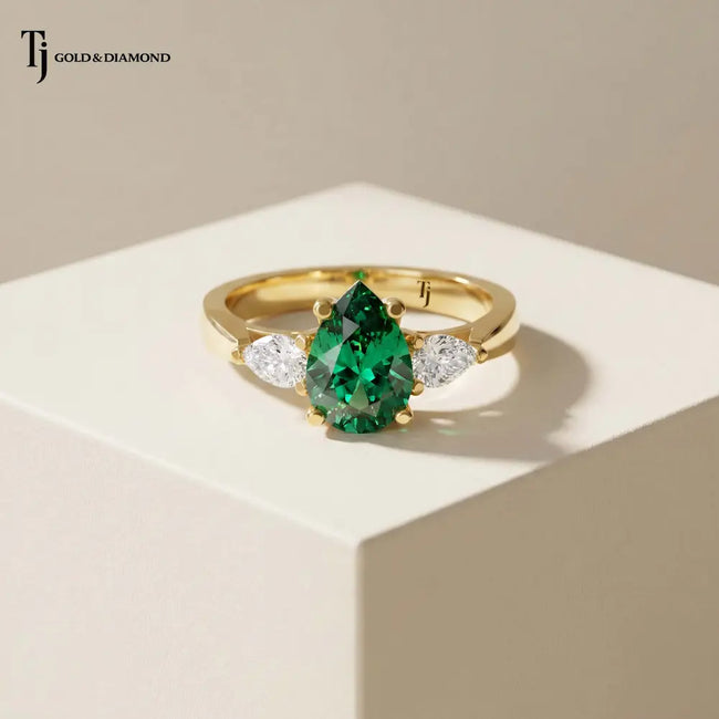 Pear Cut Created Emerald & Diamond Trilogy Ring – 18kt Yellow Gold