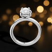 Front view of 4-claw pear cut engagement ring with hidden halo in 18kt white gold