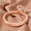 Back view of a 1.5 carat pear cut lab-grown diamond solitaire engagement ring in 18kt rose gold