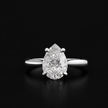 Front view of a 1.5 carat pear cut diamond solitaire engagement ring in an 18kt white gold 4 claw setting by TJ Diamond