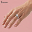 1.5 carat pear cut lab-grown diamond solitaire engagement ring in 18kt white gold worn on hand