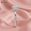 Side profile of a 1.5 carat pear cut 4-claw solitaire engagement ring in 18kt white gold
