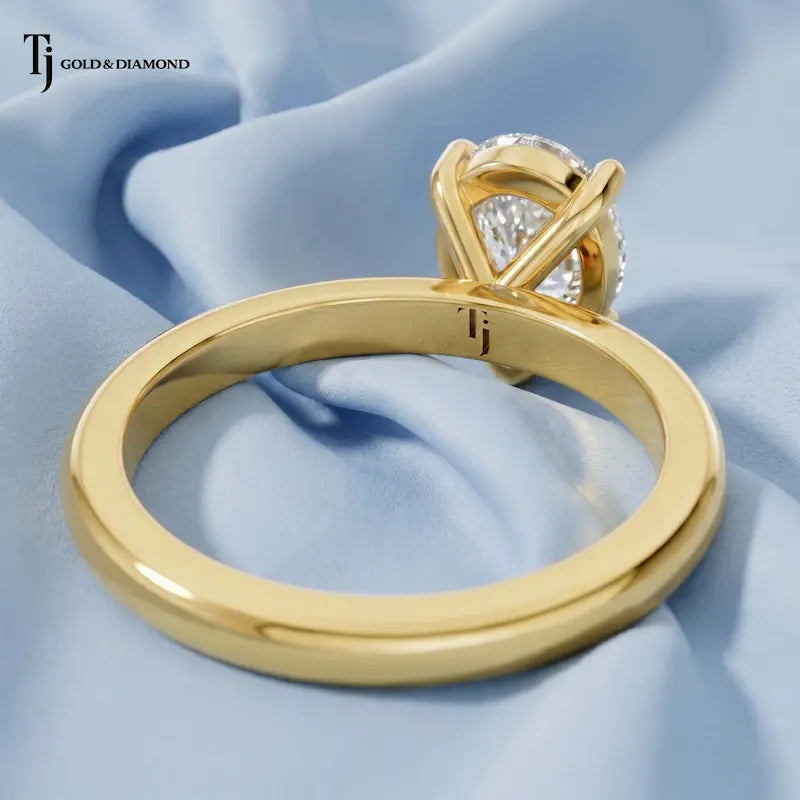 Back view of a 1.5 carat pear cut lab-grown diamond solitaire engagement ring in 18kt yellow gold